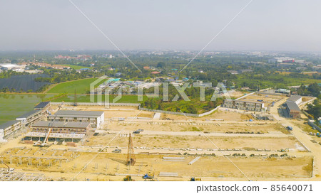 Aerial top view of dry ground rough cracks in the land with sand in factory industry for construction site. Arid pattern texture background. 85640071