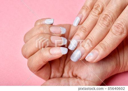 Cracked broken nail, Nail weakness damage from gel polish coating, Fingernail manicure hygiene. Cracked broken nail, Nail weakness damage from gel polish coating, Fingernail manicure hygiene. 85640602