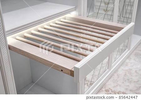 Cabinet with slide out rack for trousers in walk-in closet 85642447