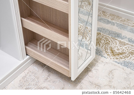 White walk-in closet with vertical slide out wooden cabinet 85642468