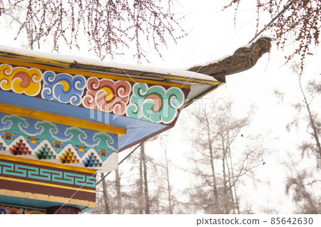 The roof of the Buddhist monastery is a traditional Tibest ornament on wood Buryat religion The roof of the Buddhist monastery is a traditional Tibest ornament on wood Buryat religion 85642630