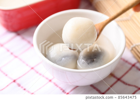 Tangyuan, Chinese dessert made of ball glutinous rice flour and filled with black sesame 85643475