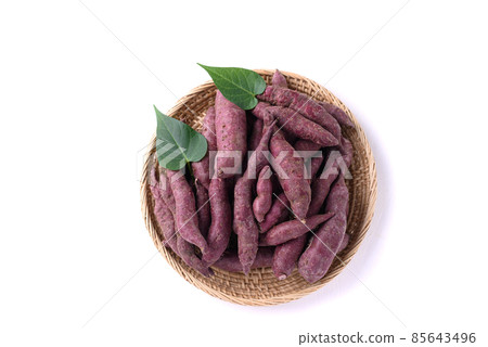 Organic purple sweet potatoes in basket on white background, Top view 85643496