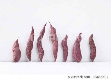 Organic purple sweet potatoes on white background, Ugly vegetable concept, food trend 85643497