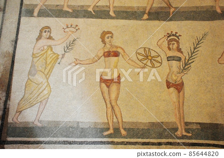 Mosaic between Italy, Sicily, Piazza Armerina, ancient Roman villa in Casale, girl in bikini 85644820