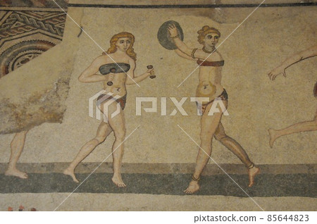 Mosaic between Italy, Sicily, Piazza Armerina, ancient Roman villa in Casale, girl in bikini 85644823