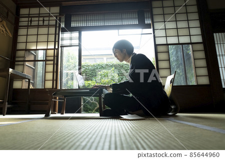 A man working at an inn A man working at an inn 85644960