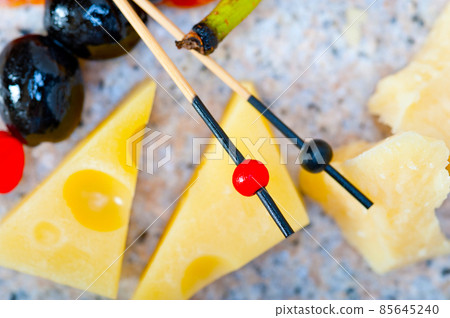 mix cold cut on a stone with fresh pears 85645240