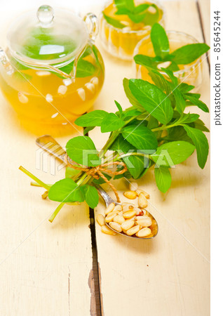 Arab traditional mint and pine nuts tea Arab traditional mint and pine nuts tea 85645244