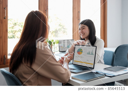 Asian business adviser meeting to analyze and discuss the situation on the financial report in the meeting room.Investment Consultant, Financial advisor and accounting concept Asian business adviser meeting to analyze and discuss the situation on the financial report in the meeting room.Investment Consultant, Financial advisor and accounting concept 85645513