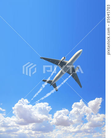 Vertical nature background with aircraft and Jet trailing smoke in the sky. Airplane and condensation trail 85645703