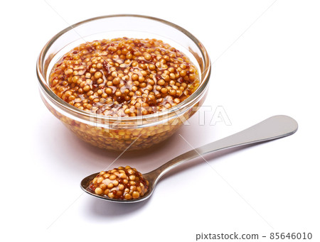 Classic Dijon mustard sauce in glass bowl isolated on white background Classic Dijon mustard sauce in glass bowl isolated on white background 85646010