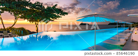 Sunset at the edge of a swimming pool at Kata beach in Phuket province, in Thailand 85646190