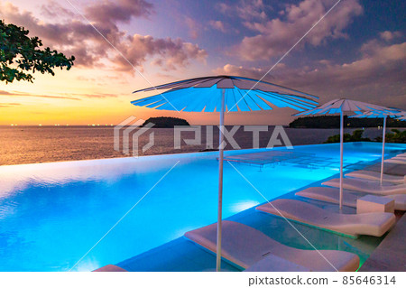 Sunset at the edge of a swimming pool at Kata beach in Phuket province, in Thailand 85646314