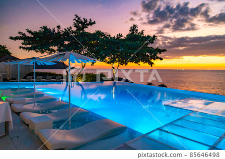 Sunset at the edge of a swimming pool at Kata beach in Phuket province, in Thailand 85646498