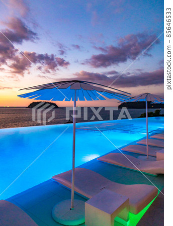 Sunset at the edge of a swimming pool at Kata beach in Phuket province, in Thailand 85646533