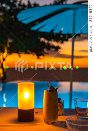 Sunset at the edge of a swimming pool at Kata beach in Phuket province, in Thailand 85646543
