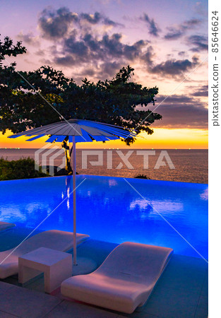 Sunset at the edge of a swimming pool at Kata beach in Phuket province, in Thailand 85646624