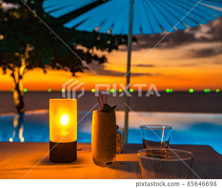 Sunset at the edge of a swimming pool at Kata beach in Phuket province, in Thailand 85646698