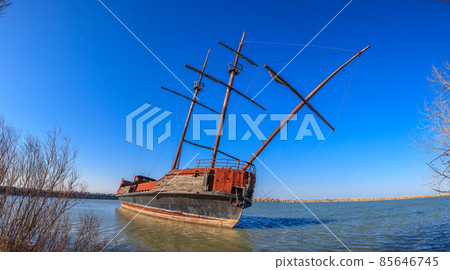 Stranded sailing ship at shore of lake Erie Stranded sailing ship at shore of lake Erie 85646745
