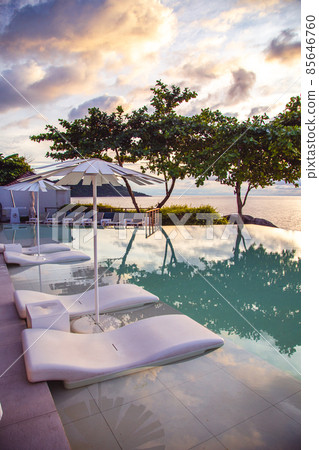 Sunset at the edge of a swimming pool at Kata beach in Phuket province, in Thailand 85646760