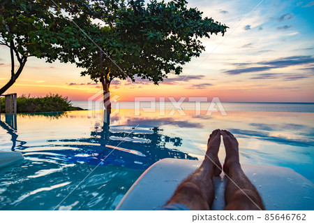 Sunset at the edge of a swimming pool at Kata beach in Phuket province, in Thailand Sunset at the edge of a swimming pool at Kata beach in Phuket province, in Thailand 85646762