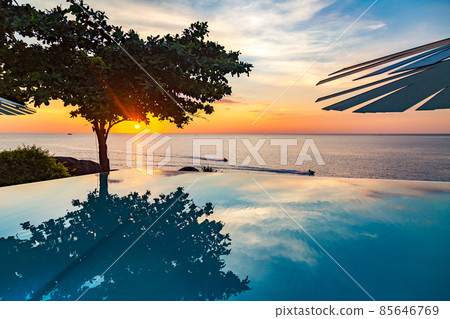 Sunset at the edge of a swimming pool at Kata beach in Phuket province, in Thailand Sunset at the edge of a swimming pool at Kata beach in Phuket province, in Thailand 85646769
