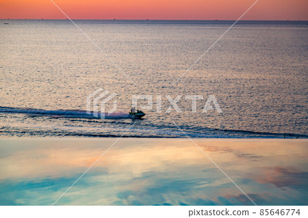 Sunset at the edge of a swimming pool at Kata beach in Phuket province, in Thailand 85646774