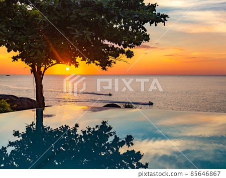 Sunset at the edge of a swimming pool at Kata beach in Phuket province, in Thailand 85646867