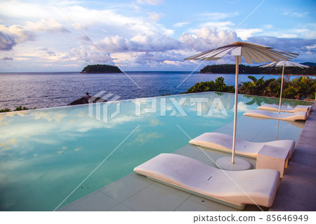 Sunset at the edge of a swimming pool at Kata beach in Phuket province, in Thailand 85646949