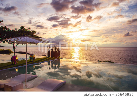 Sunset at the edge of a swimming pool at Kata beach in Phuket province, in Thailand 85646955
