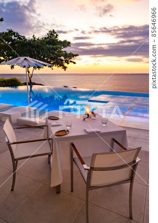 Sunset at the edge of a swimming pool at Kata beach in Phuket province, in Thailand 85646966