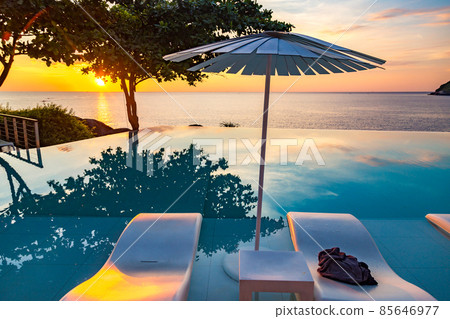 Sunset at the edge of a swimming pool at Kata beach in Phuket province, in Thailand 85646977