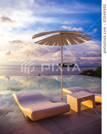 Sunset at the edge of a swimming pool at Kata beach in Phuket province, in Thailand 85646988
