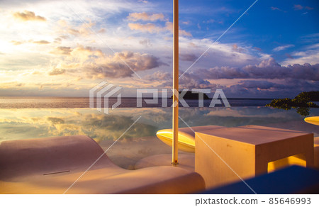 Sunset at the edge of a swimming pool at Kata beach in Phuket province, in Thailand Sunset at the edge of a swimming pool at Kata beach in Phuket province, in Thailand 85646993