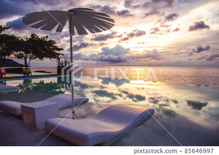 Sunset at the edge of a swimming pool at Kata beach in Phuket province, in Thailand 85646997