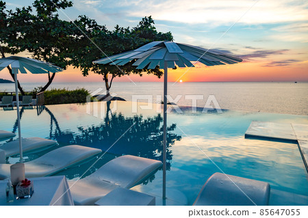 Sunset at the edge of a swimming pool at Kata beach in Phuket province, in Thailand 85647055