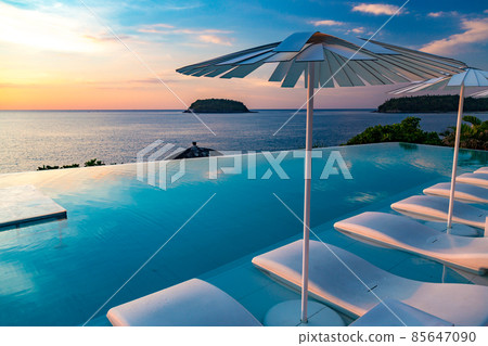 Sunset at the edge of a swimming pool at Kata beach in Phuket province, in Thailand 85647090