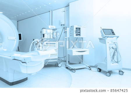 Technologically advanced equipment in CT or MRI Scan room. Modern hospital laboratory. Interior of radiography department. Magnetic resonance diagnostics machine. Technologically advanced equipment in CT or MRI Scan room. Modern hospital laboratory. Interior of radiography department. Magnetic resonance diagnostics machine. 85647425