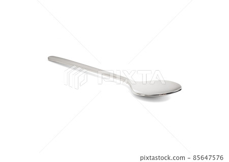 Clean shiny metal spoon isolated on white. Stainless steel small kitchen dessert teaspoon cut close up. Tablespoon. Kitchen utensils concept. 85647576