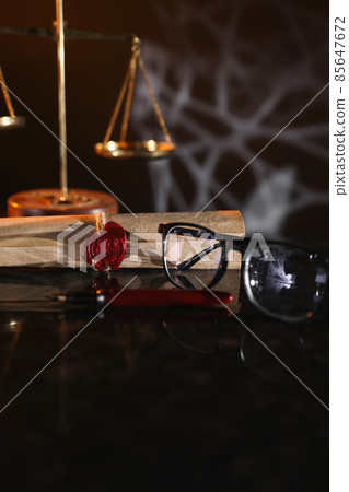 Document with wax seal, scales and antique stamp on a desk. Last will and legacy concept Document with wax seal, scales and antique stamp on a desk. Last will and legacy concept 85647672