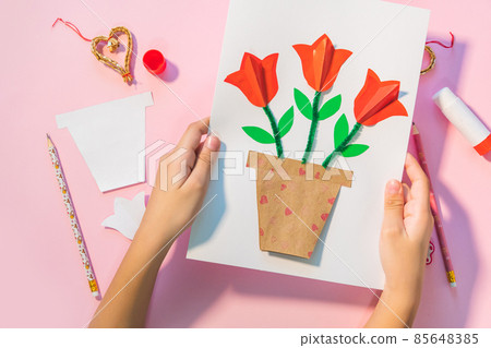 Children gift for Birthday or Mother's Day. How to make paper flower for greeting card. Simple creative art project. Step by step instructions. Children gift for Birthday or Mother's Day. How to make paper flower for greeting card. Simple creative art project. Step by step instructions. 85648385