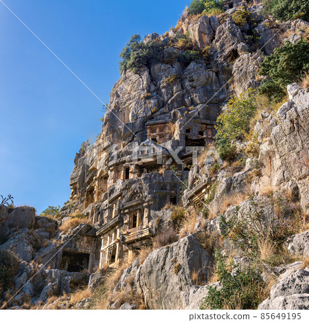 famous complex of rock tombs in the ruins of Myra Lycian (now Demre, Turkey) famous complex of rock tombs in the ruins of Myra Lycian (now Demre, Turkey) 85649195