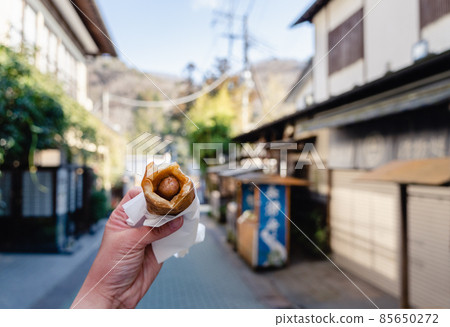 Eating and walking galette 85650272