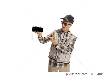 Portrait of young man wearing sport style clothes using phone isolated over white studio background Portrait of young man wearing sport style clothes using phone isolated over white studio background 85650850