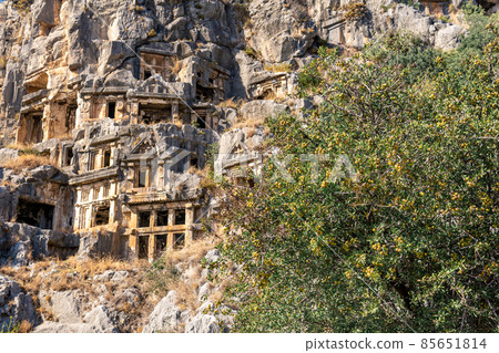 ancient tombs carved into the rocks in the ruins of Myra ancient tombs carved into the rocks in the ruins of Myra 85651814