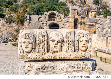 stone-cut faces - antique theater masks - in the ruins of the ancient city of Myra, Turkey stone-cut faces - antique theater masks - in the ruins of the ancient city of Myra, Turkey 85651815