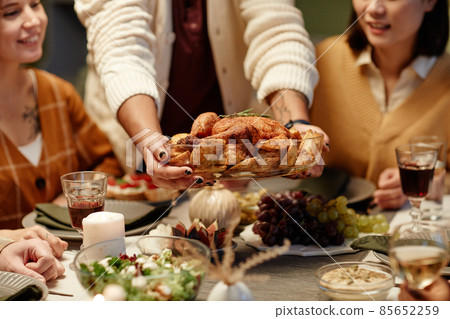 Woman serving turkey for dinner 85652259