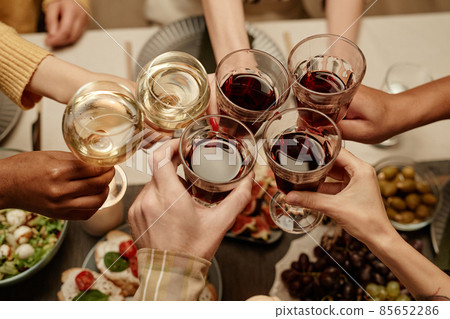 People toasting with glasses of wine People toasting with glasses of wine 85652286