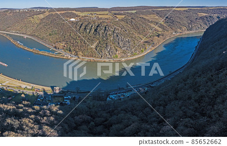 Panoramic drone image of the Loreley rock on the Rhine river taken from the opposite side of the Rhine under blue sky and sunshine 85652662